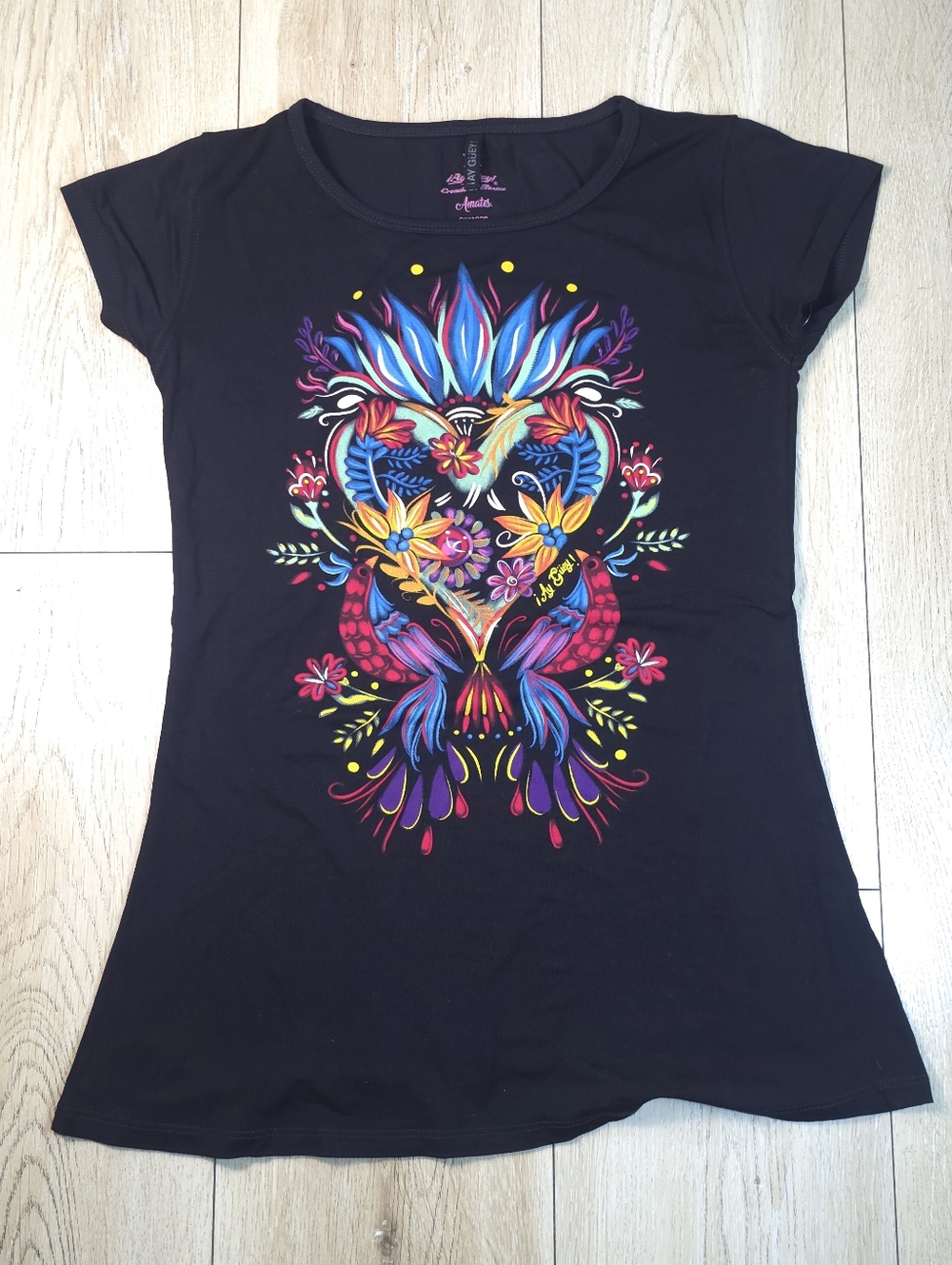 Ay Guey! Black Tee with Vibrant Multicolor Floral Heart